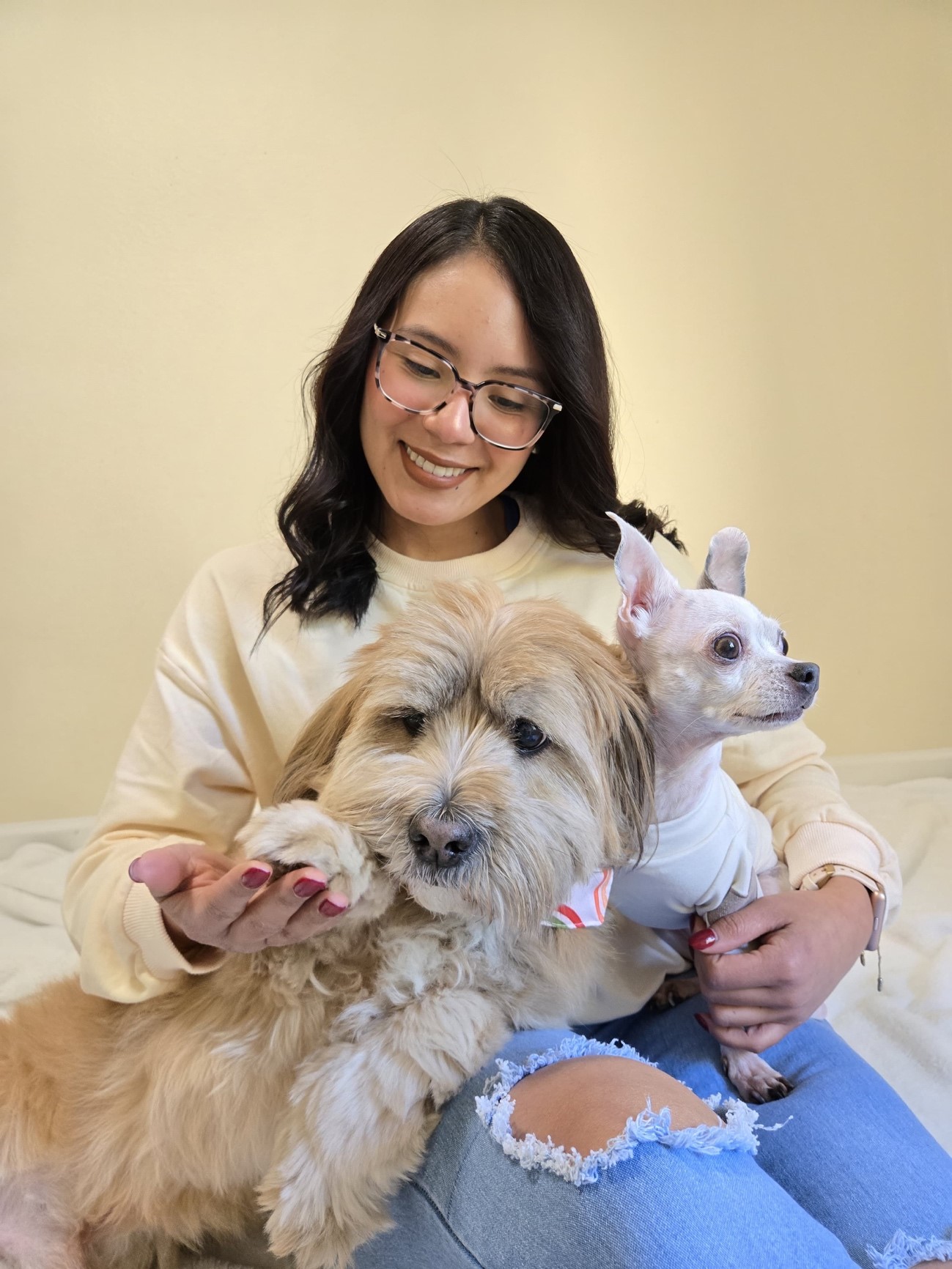 Laura with her two pups at Happy Little Paws